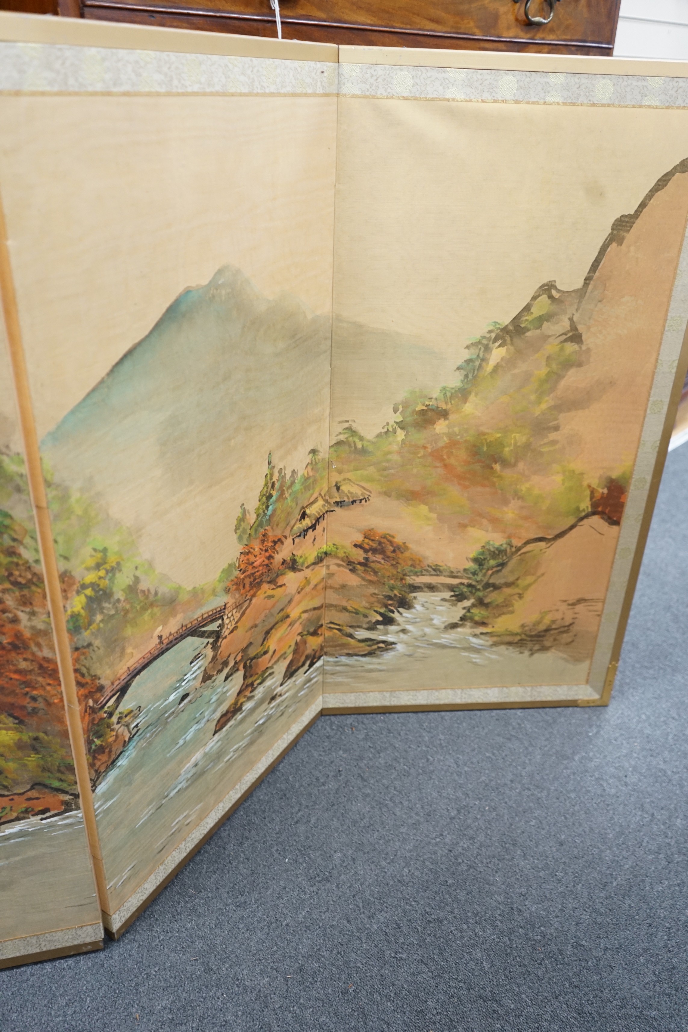 A Chinese painted four fold low screen, each panel width 46cm, height 91cm